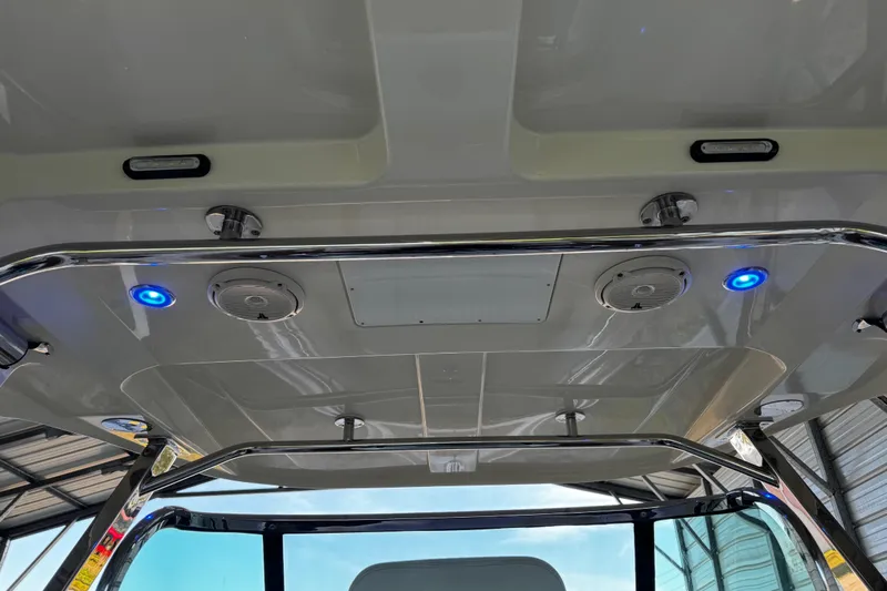  Yacht Photos Pics 2019 Chris-Craft Catalina 26 boat interior with blue LED lights and speakers.