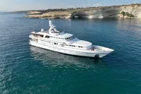 Luxury 1986 Motor Yacht 38m Nicolini cruising in clear blue waters.