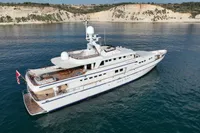 Luxurious 1986 Motor Yacht 38m Nicolini cruising near scenic cliffs.