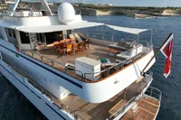 Luxurious 1986 38m Nicolini motor yacht with spacious deck and elegant seating area.