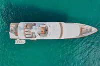Aerial view of 1986 38m Nicolini motor yacht on turquoise water.