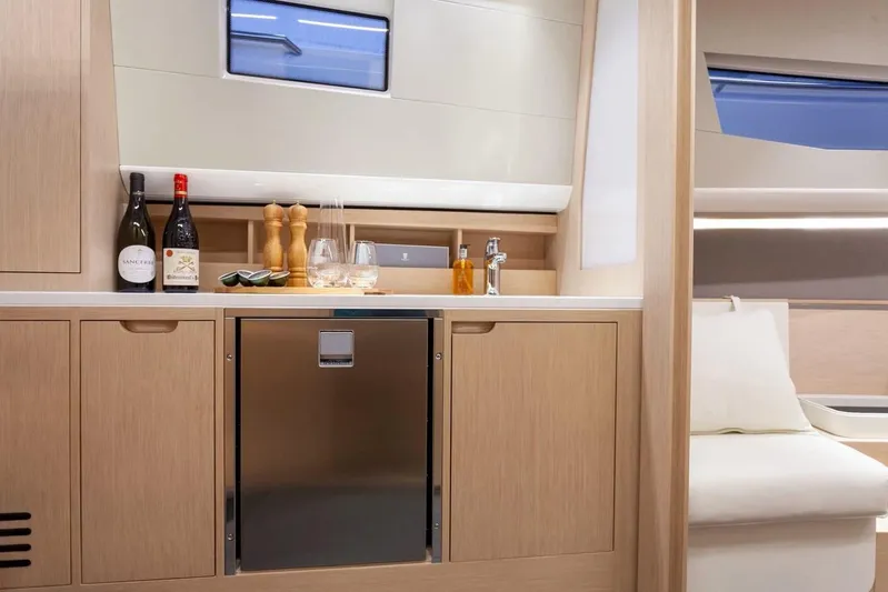  Yacht Photos Pics Luxurious interior of 2022 Windy SR 44 BLACKHAWK yacht with modern kitchenette and seating area.