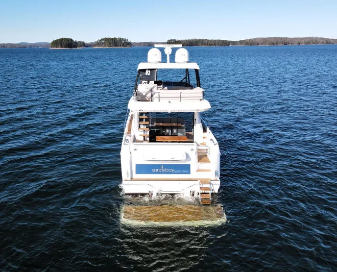 Sandybay Yacht Photos Pics Prestige 520 Fly 2022 yacht on open water, rear view.