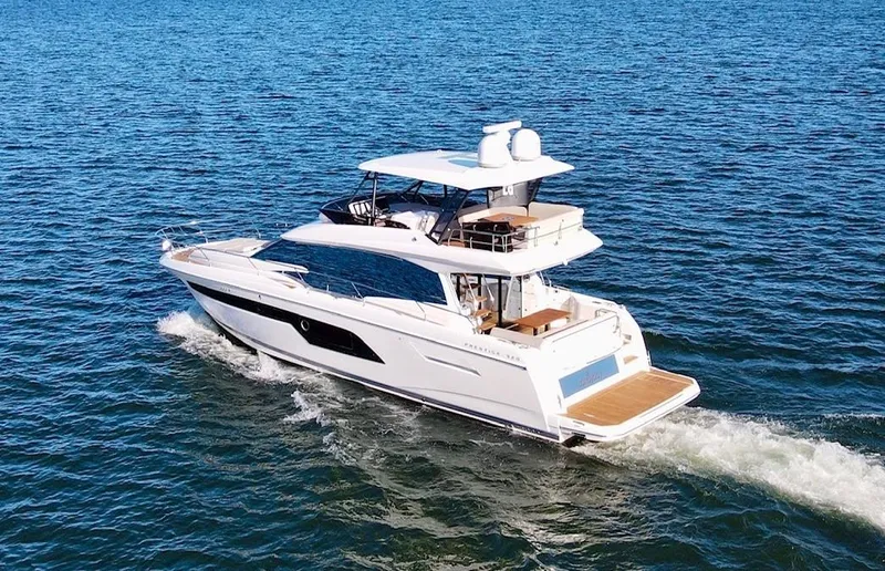 Sandybay Yacht Photos Pics 2022 Prestige 520 Fly yacht cruising on open water.