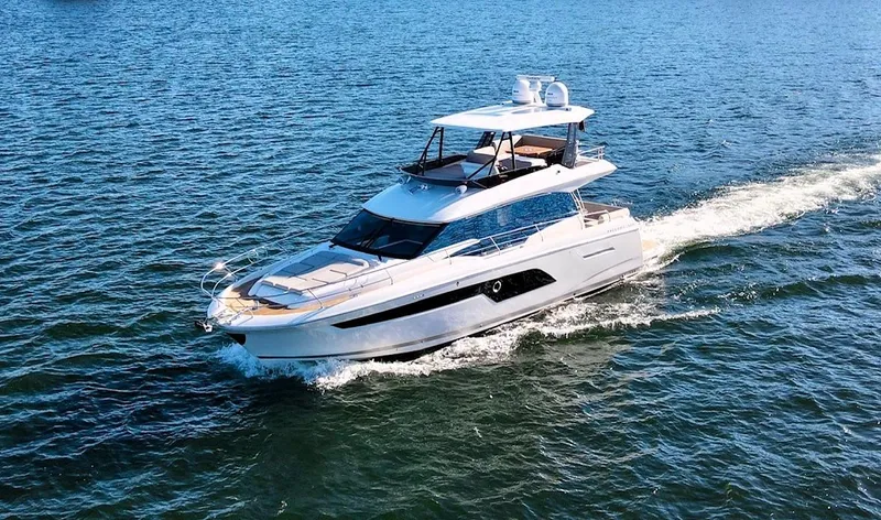 Sandybay Yacht Photos Pics 2022 Prestige 520 Fly yacht cruising on open water.