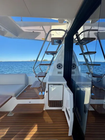 Sandybay Yacht Photos Pics Prestige 520 Fly 2022 yacht deck with modern seating and ocean view.