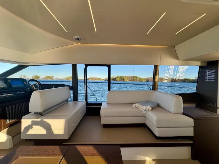 Sandybay Yacht Photos Pics Luxurious interior of 2022 Prestige 520 Fly yacht with scenic water view.
