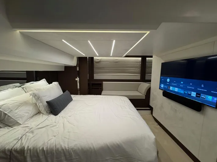 Sandybay Yacht Photos Pics Luxurious bedroom interior of 2022 Prestige 520 Fly yacht with modern design and large TV.