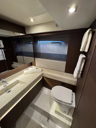 Sandybay Yacht Photos Pics Luxurious bathroom in 2022 Prestige 520 Fly yacht with modern fixtures and elegant design.