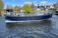 2018 Davy & Orsted 10.50 Open boat on a scenic river under blue skies.