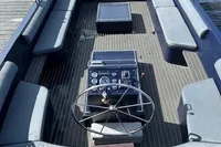 Spacious 2018 Davy & Orsted 10.50 open boat with modern seating and control panel.