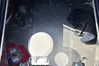 Interior view of a 2018 Davy & Orsted 10.50 open boat, featuring a compact toilet.
