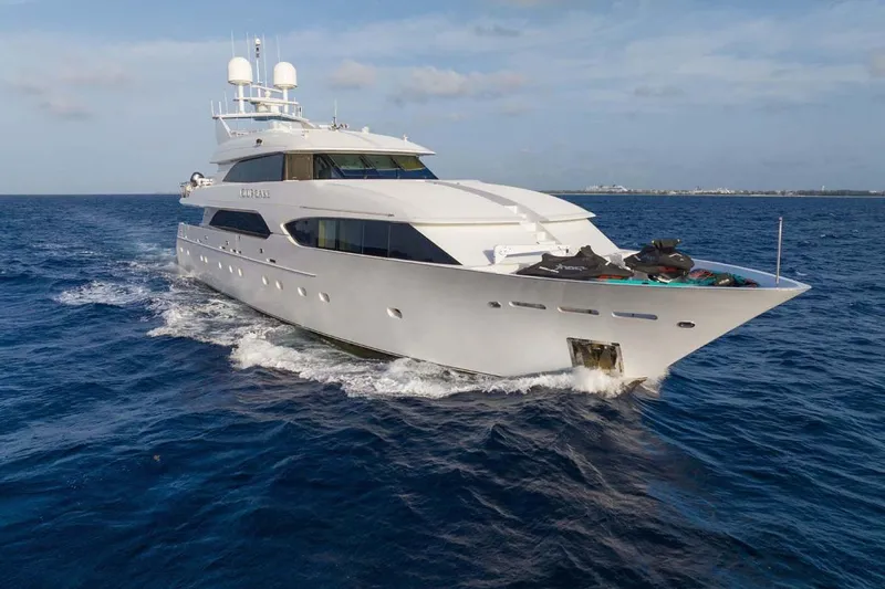 Cupcake Yacht Photos Pics Luxurious 2001 Westship Skylounge yacht cruising on open sea under clear skies.