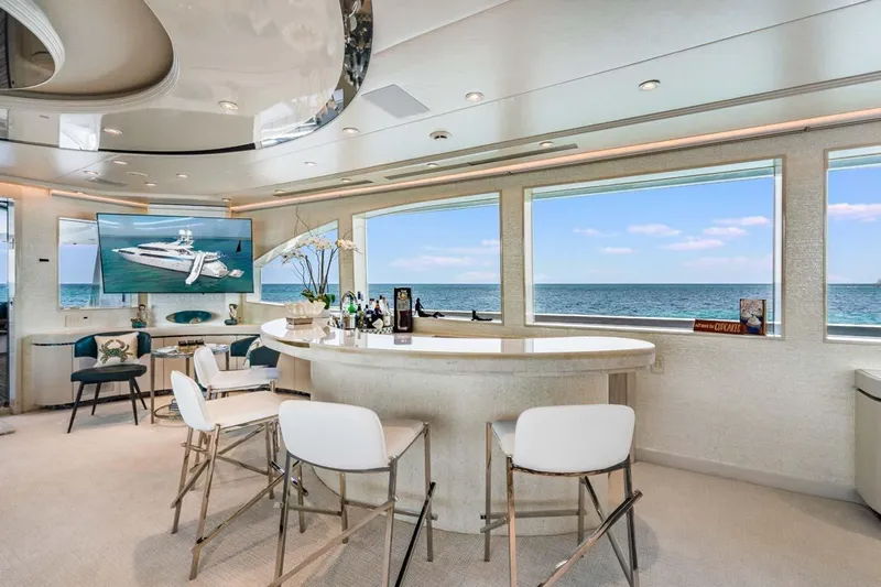 Cupcake Yacht Photos Pics Luxurious 2001 Westship Skylounge interior with ocean view, featuring elegant bar and seating area.