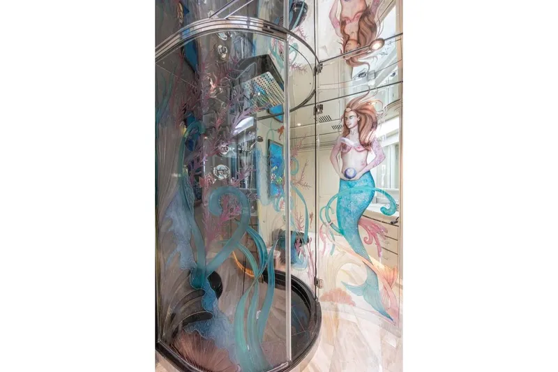 Cupcake Yacht Photos Pics Luxurious 2001 Westship Skylounge shower with mermaid-themed glass art.