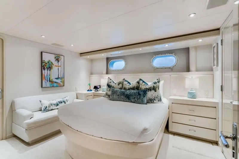 Cupcake Yacht Photos Pics Luxurious bedroom in 2001 Westship Skylounge yacht with elegant decor and porthole windows.