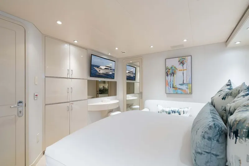 Cupcake Yacht Photos Pics Luxurious bedroom interior of 2001 Westship Skylounge yacht with modern decor and artwork.