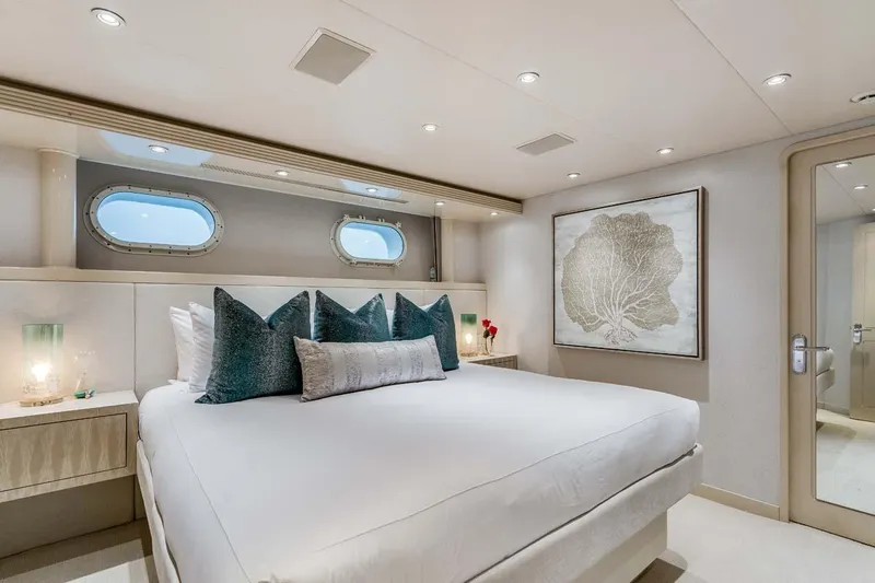 Cupcake Yacht Photos Pics Luxurious 2001 Westship Skylounge bedroom with elegant decor and ocean-view portholes.