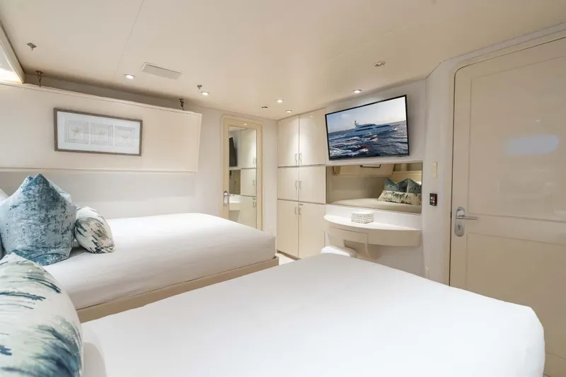 Cupcake Yacht Photos Pics Luxurious 2001 Westship Skylounge yacht bedroom with modern decor and wall-mounted TV.