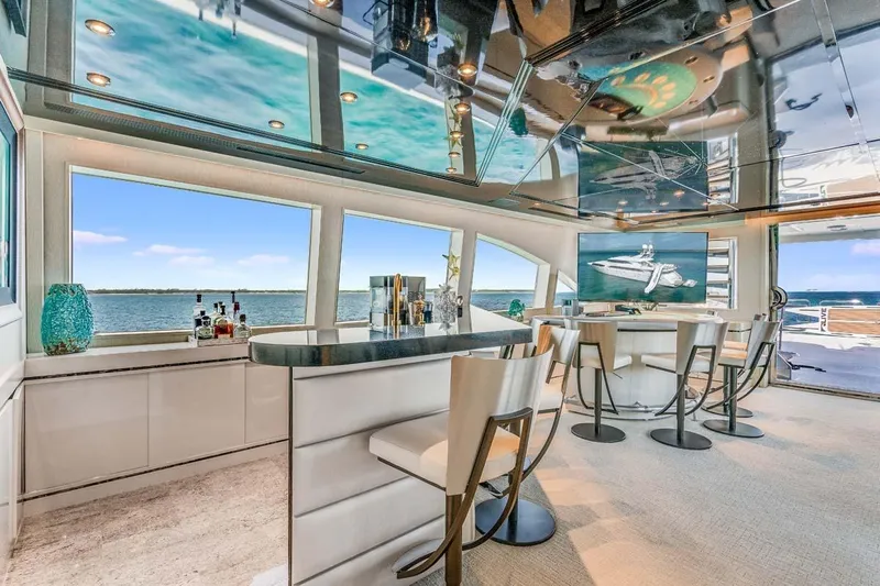 Cupcake Yacht Photos Pics Luxurious 2001 Westship Skylounge interior with bar, ocean view, and modern decor.