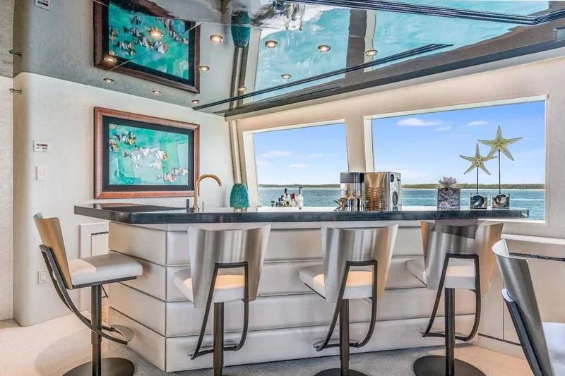 Cupcake Yacht Photos Pics Luxurious yacht interior with modern bar, stylish stools, and ocean view; Westship Skylounge 2001.