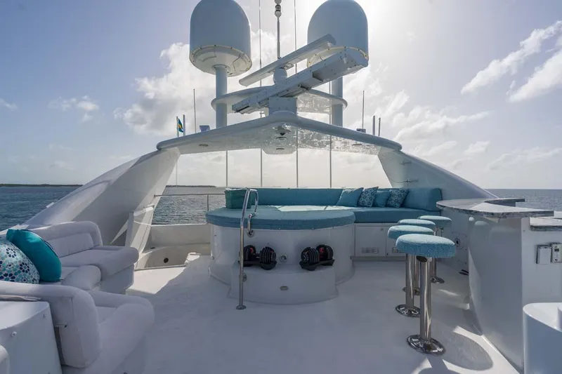 Cupcake Yacht Photos Pics Luxurious 2001 Westship Skylounge yacht deck with seating, bar stools, and ocean view.