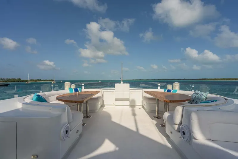 Cupcake Yacht Photos Pics Luxurious 2001 Westship Skylounge yacht deck with seating, tables, and ocean view.