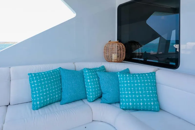 Cupcake Yacht Photos Pics Luxurious Westship Skylounge 2001 yacht interior with turquoise cushions and wicker decor.