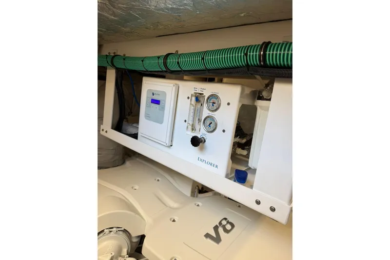 Atkun Yacht Photos Pics Engine room of 2021 Sunseeker Manhattan 68 yacht with V8 engine and control panel.