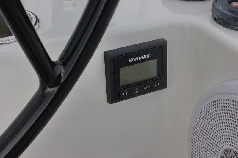  Yacht Photos Pics Yanmar control panel on 2022 Beneteau Oceanis Yacht 54, near steering wheel and speaker.
