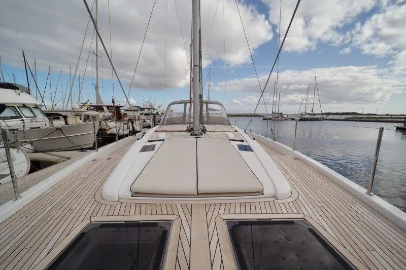 Yacht Photos Pics 2022 Beneteau Oceanis Yacht 54 docked, showcasing sleek deck design and spacious layout.
