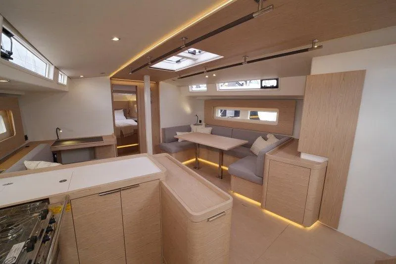  Yacht Photos Pics Luxurious interior of 2022 Beneteau Oceanis Yacht 54 with modern design and spacious seating.