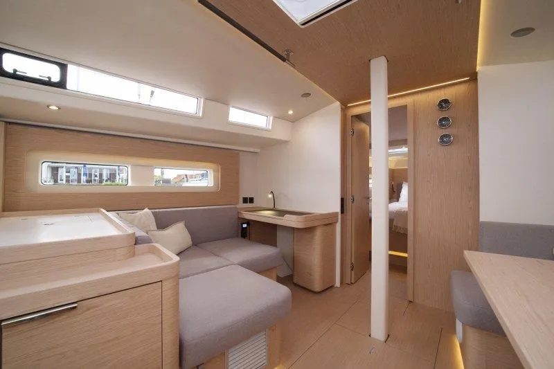  Yacht Photos Pics Luxurious interior of 2022 Beneteau Oceanis Yacht 54 with modern design and cozy seating.