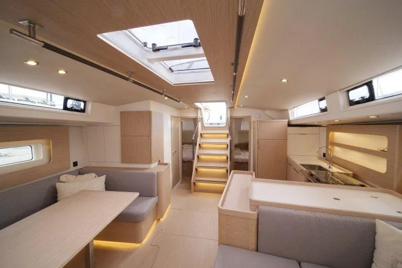  Yacht Photos Pics Luxurious interior of 2022 Beneteau Oceanis Yacht 54, featuring modern design and ample natural light.