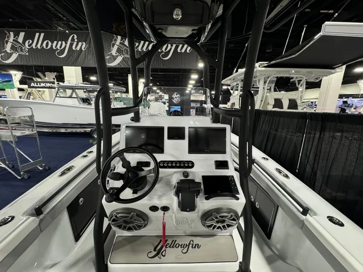 Yacht Photos Pics 2025 Yellowfin 26 Hybrid boat interior with modern dashboard and steering wheel.