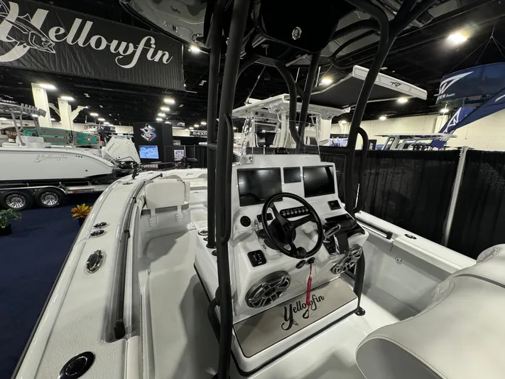  Yacht Photos Pics 2025 Yellowfin 26 Hybrid boat interior at a boat show, showcasing modern controls and design.