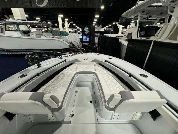  Yacht Photos Pics 2025 Yellowfin 26 Hybrid boat interior at a boat show, featuring sleek seating design.