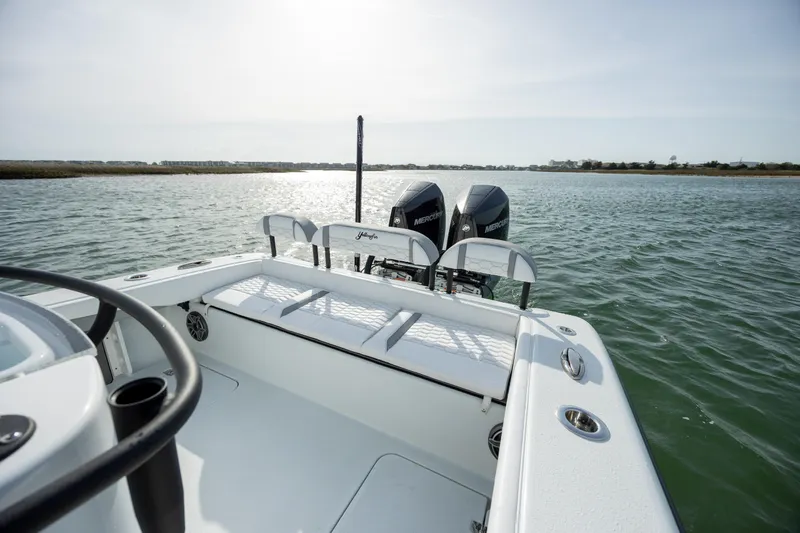  Yacht Photos Pics 2025 Yellowfin 26 Hybrid boat on water, featuring dual outboard motors.