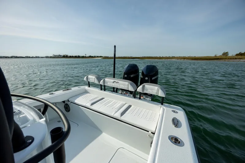  Yacht Photos Pics 2025 Yellowfin 26 Hybrid boat on water, featuring dual outboard motors.