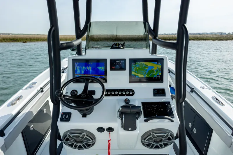  Yacht Photos Pics 2025 Yellowfin 26 Hybrid boat dashboard with advanced navigation screens and controls on open water.