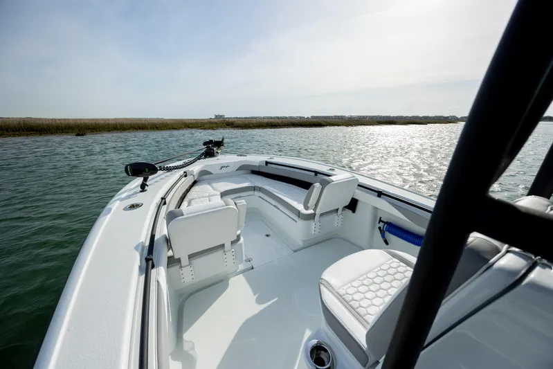  Yacht Photos Pics 2025 Yellowfin 26 Hybrid boat interior with seating, on calm water.