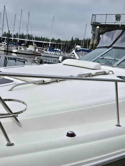 O Sea D Yacht Photos Pics 2007 Sea Ray 340 Sundancer yacht docked at a marina with sailboats in the background.