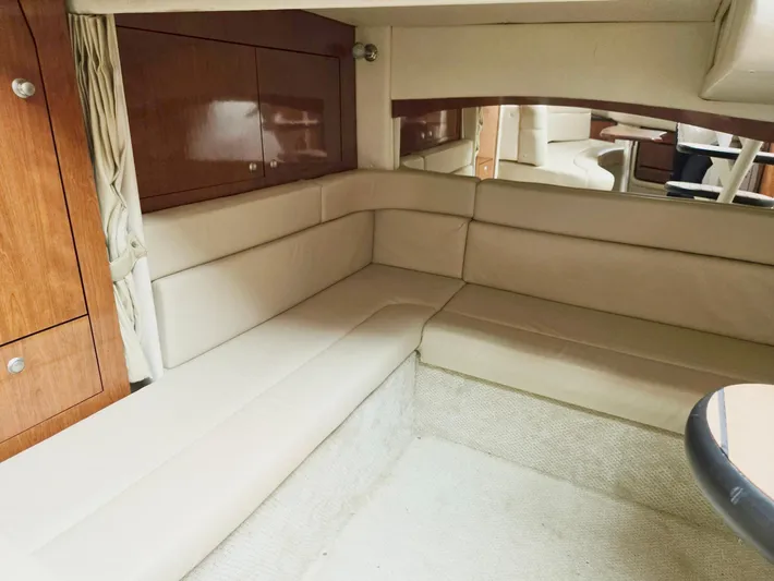 O Sea D Yacht Photos Pics 2007 Sea Ray 340 Sundancer interior with beige seating and wooden cabinetry.