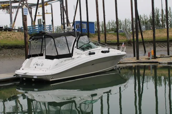O Sea D Yacht Photos Pics 2007 Sea Ray 340 Sundancer docked in a marina, reflecting on calm water.