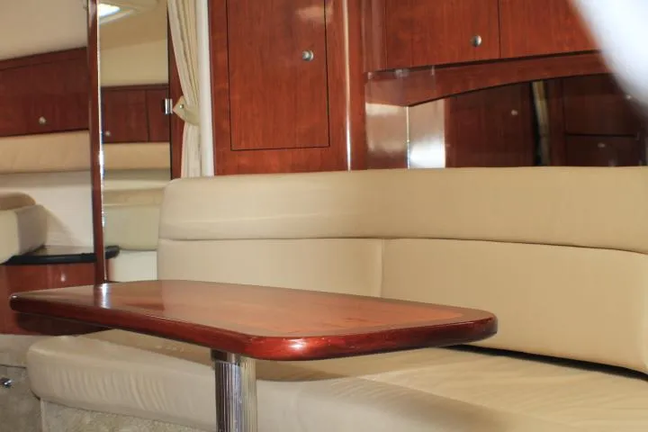 O Sea D Yacht Photos Pics Interior of 2007 Sea Ray 340 Sundancer with beige seating and wooden table.