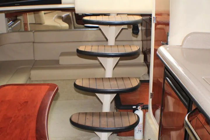 O Sea D Yacht Photos Pics Interior of 2007 Sea Ray 340 Sundancer yacht with wooden steps and modern furnishings.