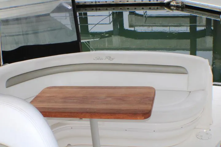 O Sea D Yacht Photos Pics 2007 Sea Ray 340 Sundancer interior with white seating and wooden table.