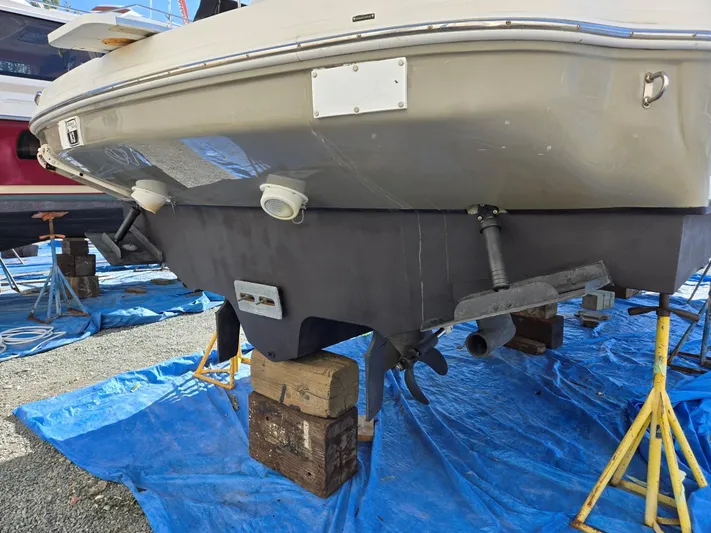 O Sea D Yacht Photos Pics 2007 Sea Ray 340 Sundancer boat on stands, hull view, blue tarp underneath.