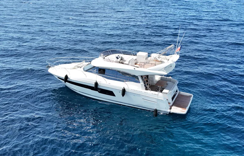  Yacht Photos Pics 2018 Prestige 460 Fly yacht cruising on open blue sea.