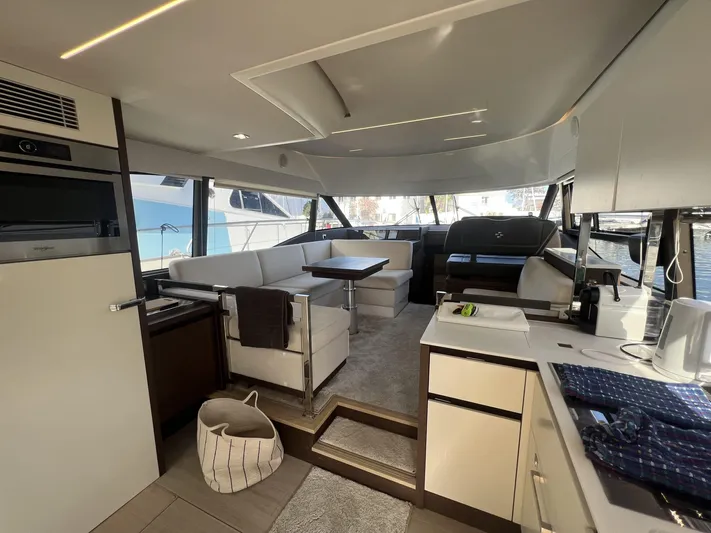  Yacht Photos Pics Luxurious interior of a 2018 Prestige 460 Fly yacht, featuring modern furnishings and spacious layout.